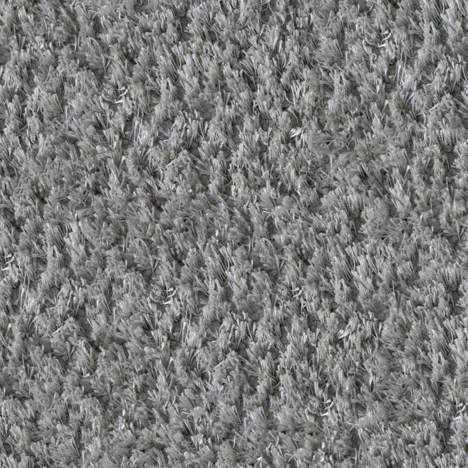 A close view of deep grey carpet pile fibres